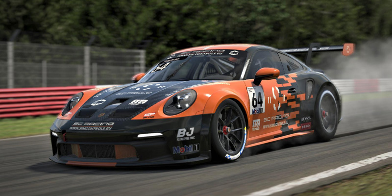 Racing 5 A Porsche Cup car locking up the brakes on track with a trail of tire smoke behind it.