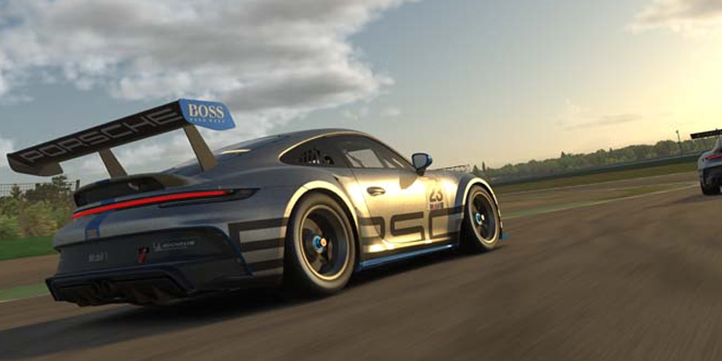 Racing 6 A Porsche Cup car racing on a track at sunset