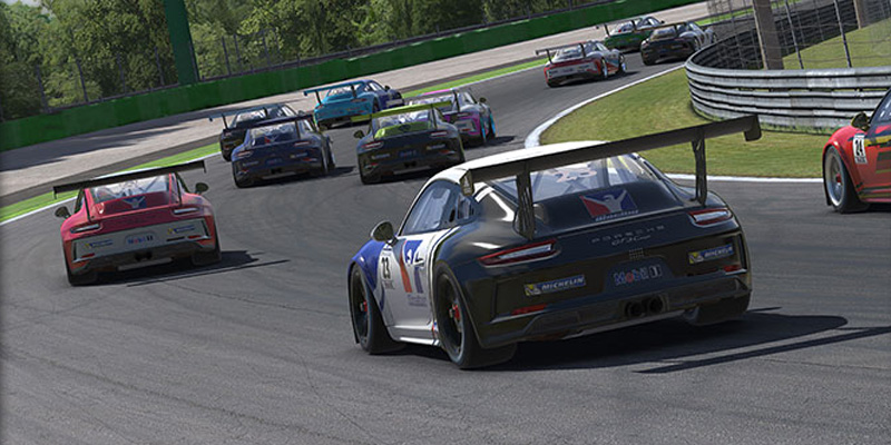 Racing 7 A group of Porsche Cup cars going through a corner on a racetrack